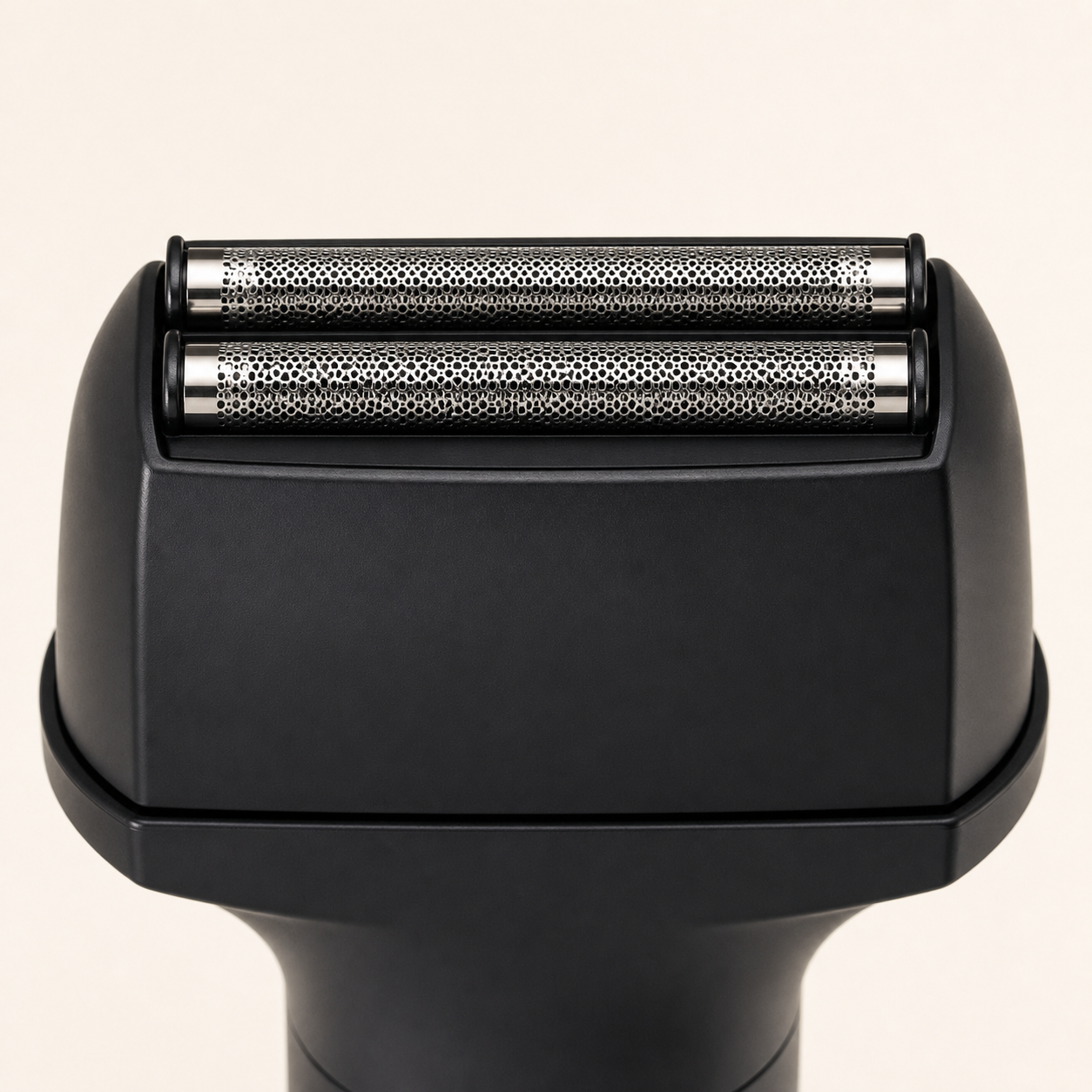Black cordless foil shaver — dual-foil head detail